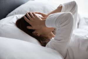 Woman frustrated trying to sleep with RLS symptoms in Minneapolis, MN
