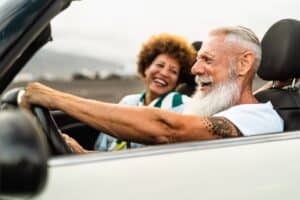 Man and woman driving in Minneapolis, MN